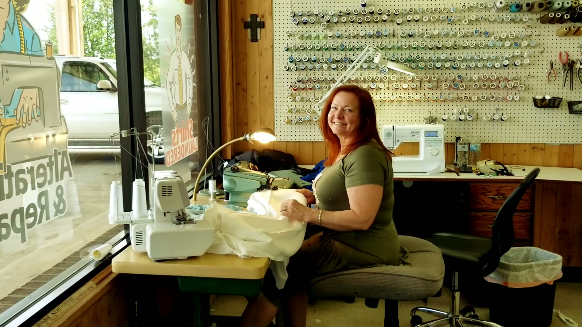 Our seamstress at her machine in the alterations room